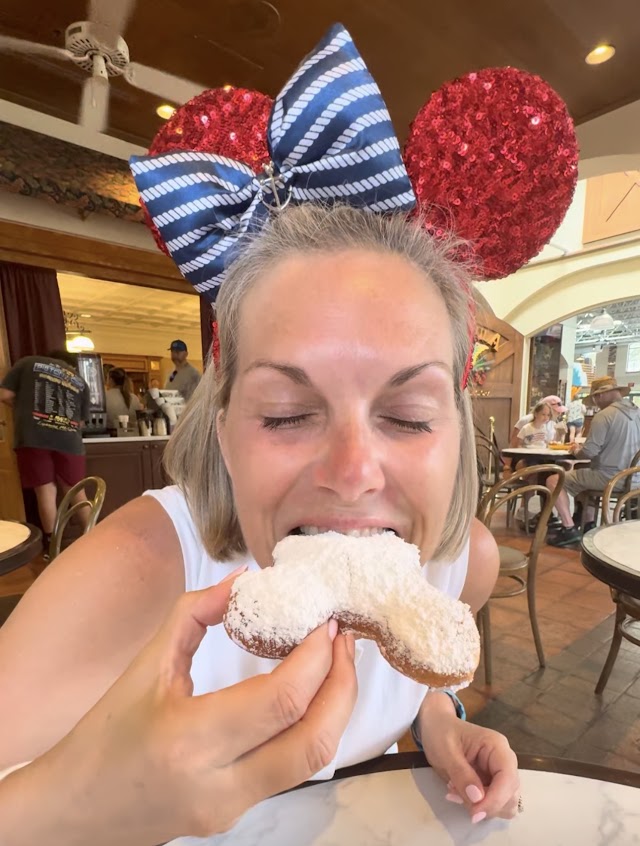 Melissa enjoying a powdered-sugar beignet at Disney's Port Orleans French Quarter