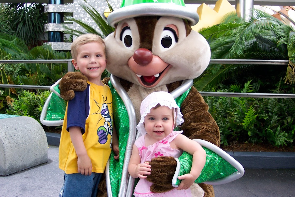 Two young children posing with Chip at Walt Disney World