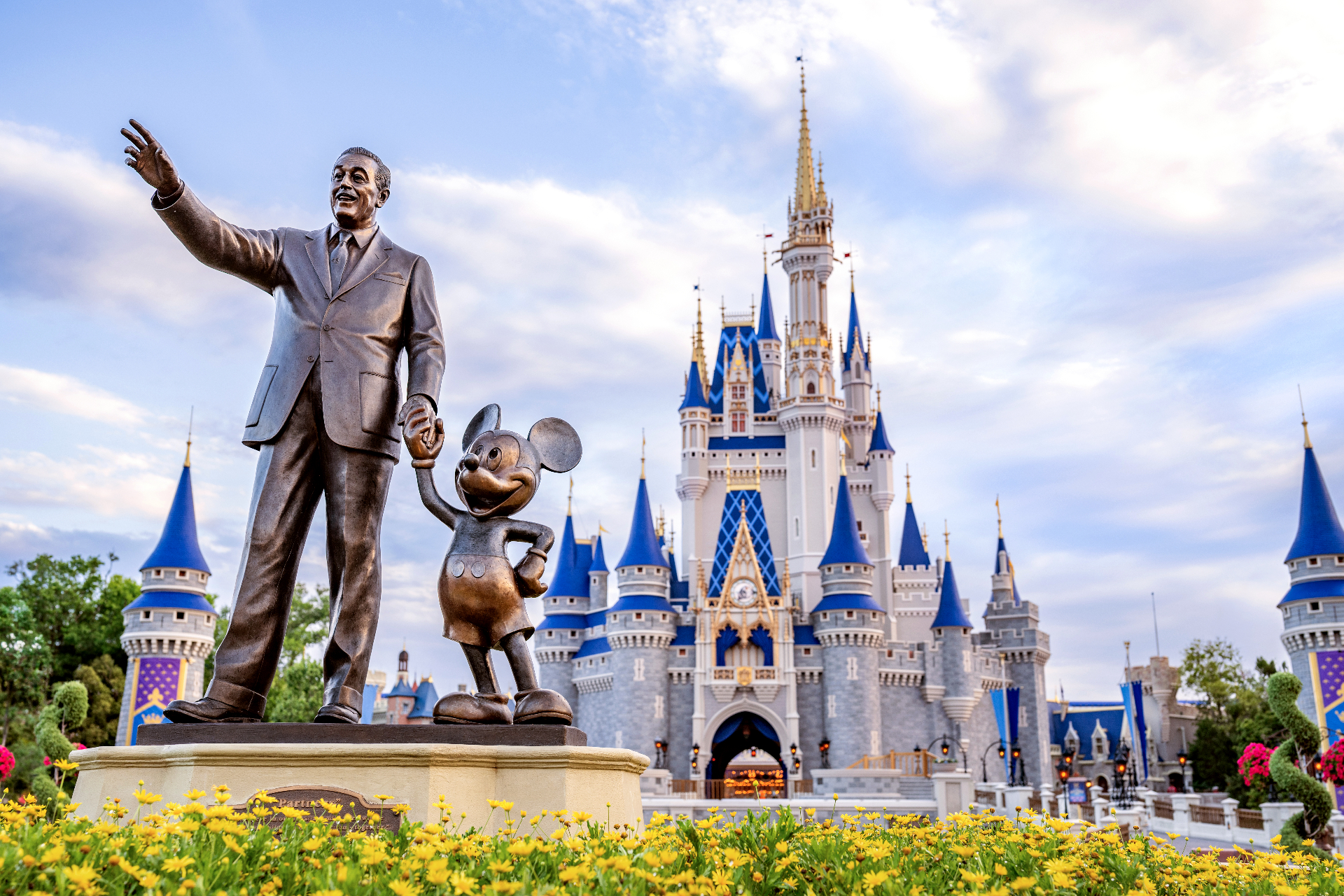 Walt Disney and Mickey Mouse Partners statue in front of Cinderella Castle at Magic Kingdom